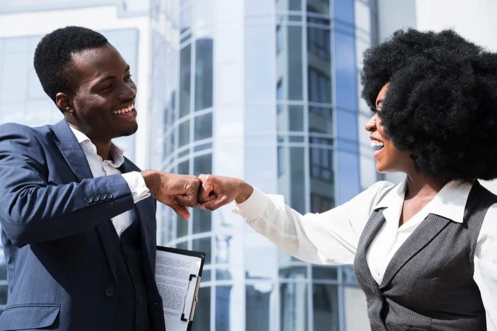 Business professionals celebrating a partnership