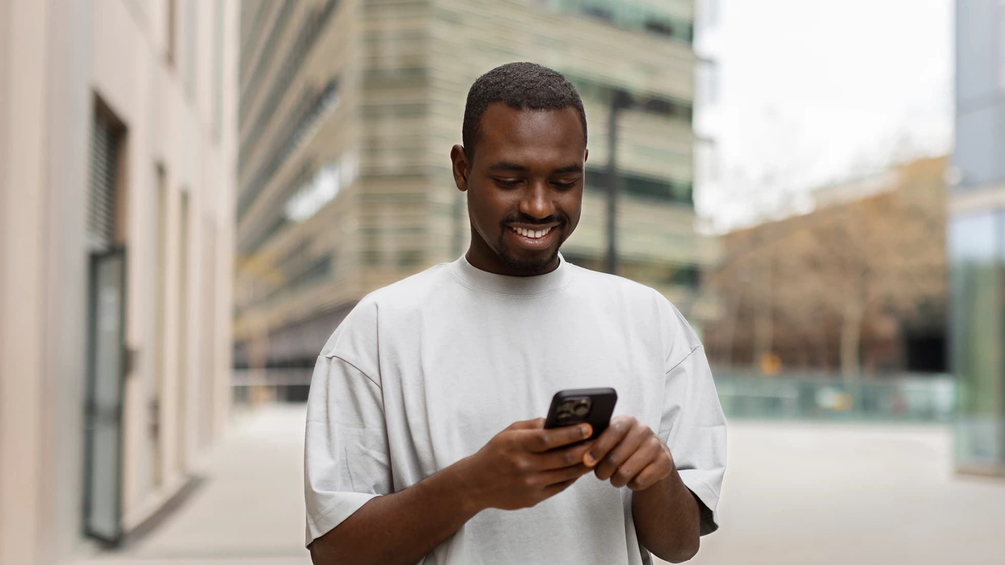 A subscriber using his new smartphone in the city