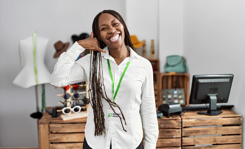 A smiling Mission Mobile team member ready to help in store
